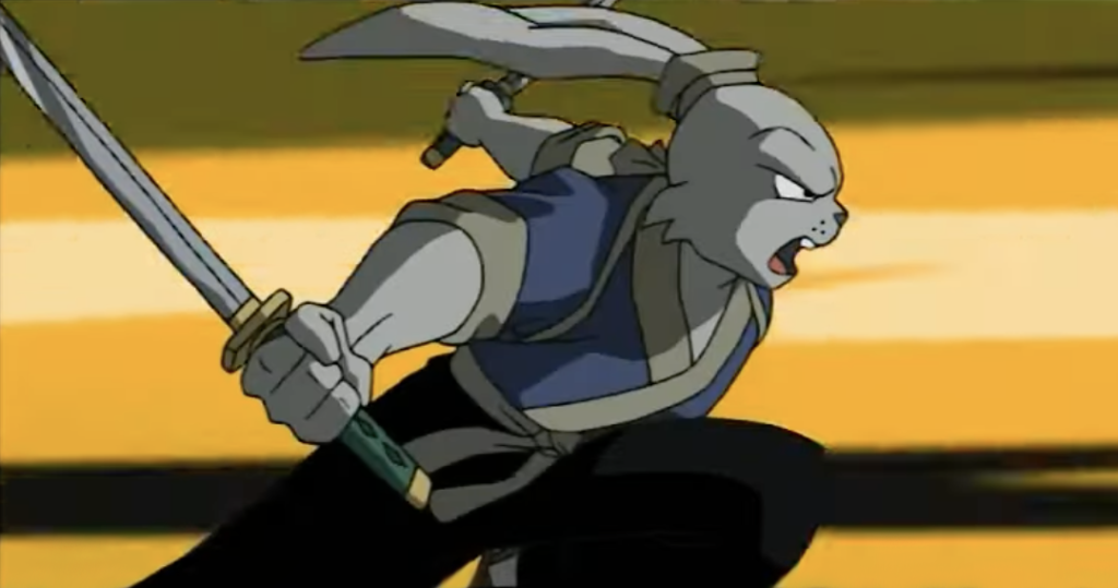 usagi yojimbo the samurai rabbit holds two swords as his ears blow backwards