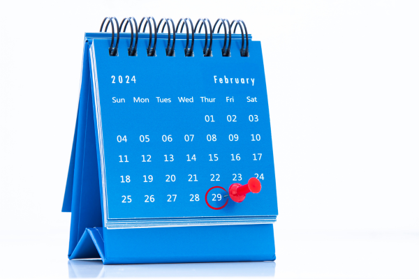 a desk calendar showing the month of february 2024. the 29th is circled with a red circle and highlighted with a thumbtack.