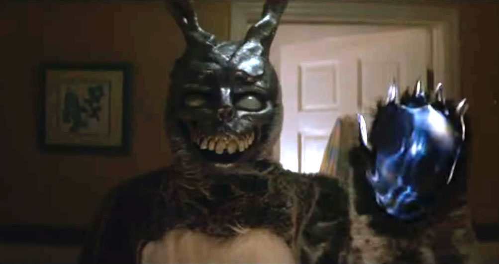 a person wears a scary bunny costume with big teeth and claws.