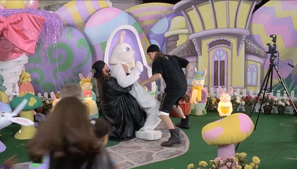 Two men dressed in black punch and hit an Easter bunny at the mall.